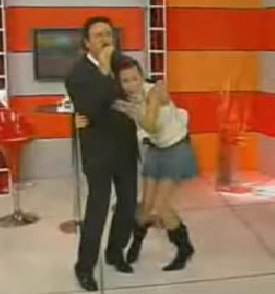 TV Host Gets Hair Stuck to Singer